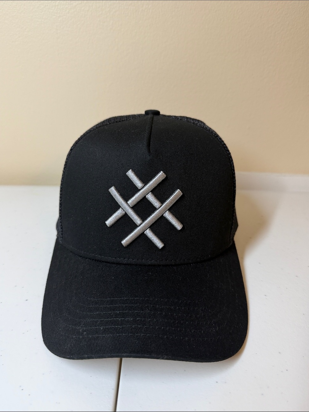 Lucid FC Black Trucker Hat with Silver Embroidered Geometric Logo, Rihanna style
